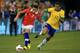 TORONTO, ON - NOVEMBER 19: Alexis Sanchez #7 of Chile carries the ball against Luiz Gustavo #17 of Brazil during a friendly match at Rogers Centre on November 19, 2013 in Toronto, Canada. (Photo by Dave Sandford/Getty Images)
