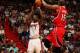 MIAMI, FL - NOVEMBER 19: Chris Bosh #1 of the Miami Heat shoots against Al Horford #15 of the Atlanta Hawks on November 19, 2013 at American Airlines Arena in Miami, Florida. NOTE TO USER: User expressly acknowledges and agrees that, by downloading and/or
