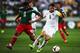 WELLINGTON, NEW ZEALAND - NOVEMBER 20: Carlos Pena of Mexico defends against Tommy Smith of New Zealand during leg 2 of the FIFA World Cup Qualifier match between the New Zealand All Whites and Mexico at Westpac Stadium on November 20, 2013 in Wellington,