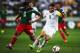 WELLINGTON, NEW ZEALAND - NOVEMBER 20: Carlos Pena of Mexico defends against Tommy Smith of New Zealand during leg 2 of the FIFA World Cup Qualifier match between the New Zealand All Whites and Mexico at Westpac Stadium on November 20, 2013 in Wellington,