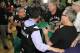 Team Rios member Donald Leary is held back from giving Freddie Roach his right hook.