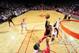 HOUSTON, TX - NOVEMBER 11: DeMar DeRozan #10 of the Toronto Raptors shoots the ball against James Harden #13 and Dwight Howard #12 of the Houston Rockets on November 11, 2013 at the Toyota Center in Houston, Texas. NOTE TO USER: User expressly acknowledg