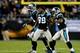 CHARLOTTE, NC - NOVEMBER 18: Steve Smith #89 of the Carolina Panthers reacts as he runs onto the field after a play with teammates Brandon LaFell #11 and DeAngelo Williams #34 during their game against the New England Patriots at Bank of America Stadiu