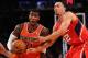 NEW YORK, NY - NOVEMBER 16: Iman Shumpert #21 of the New York Knicks drives against John Jenkins #12 of the Atlanta Hawks during the second half at Madison Square Garden on November 16, 2013 in New York City. The Hawks defeat the Knicks 110-90. NOTE TO U