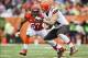 Nov 17, 2013; Cincinnati, OH, USA; Cincinnati Bengals middle linebacker Vincent Rey (57) tackles Cleveland Browns tight end Jordan Cameron (84) during the game at Paul Brown Stadium. Cincinnati won 41-20. Mandatory Credit: Kevin Jairaj-USA TODAY Sports