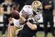 Nov 17, 2013; New Orleans, LA, USA; San Francisco 49ers outside linebacker Ahmad Brooks (55) clotheslines New Orleans Saints quarterback Drew Brees (9) behind the line of scrimmage during the fourth quarter at the Mercedes-Benz Superdome. San Francisco 49