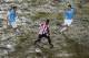 Javi Garcia and Matija Nastasic on a muddy pitch in Hong Kong in pre-season