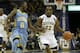 MILWAUKEE, WI - NOVEMBER 08: Derrick Wilson #12 of the Golden Eagles dribbles up the court with Chrisoher Hyder #0 of the Southern Jaguars defending during the first half of play at BMO Harris Bradley Center on November 08, 2013 in Madison, Wisconsin. (P