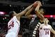 RALEIGH, NC - DECEMBER 22: T.J. Warren #24 of the North Carolina State Wolfpack blocks a shot by Marquise Simmons #33 of the St. Bonaventure Bonnies during play at PNC Arena on December 22, 2012 in Raleigh, North Carolina. (Photo by Grant Halverson/Gett