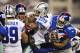 ARLINGTON, TX - SEPTEMBER 8: DeMarco Murray #29 of the Dallas Cowboys is gang tackled by a group of New York Giants at AT&T Stadium on September 8, 2013 in Arlington, Texas. The Cowboys defeated the Giants 31-36. (Photo by Wesley Hitt/Getty Images)