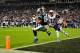 CHARLOTTE, NC - NOVEMBER 18: Greg Olsen #88 of the Carolina Panthers makes a touchdown catch as Devin McCourty #32 of the New England Patriots defends during play at Bank of America Stadium on November 18, 2013 in Charlotte, North Carolina. The Panthers