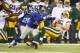 EAST RUTHERFORD, NJ - NOVEMBER 17: Jacquian Williams #57 of the New York Giants tackles Scott Tolzien #16 of the Green Bay Packers during their game at MetLife Stadium on November 17, 2013 in East Rutherford, New Jersey. (Photo by Al Bello/Getty Image