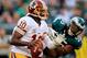 PHILADELPHIA, PA - NOVEMBER 17: Quarterback Robert Griffin III #10 of the Washington Redskins looks to pass while being pressured by linebacker Brandon Graham #55 of the Philadelphia Eagles during the second half at Lincoln Financial Field on November 17,