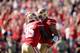 SAN FRANCISCO, CA - OCTOBER 13: Colin Kaepernick #7 congratulates Vernon Davis #85 of the San Francisco 49ers after he scored a touchdown at Candlestick Park on October 13, 2013 in San Francisco, California. (Photo by Ezra Shaw/Getty Images)