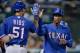 OAKLAND, CA - SEPTEMBER 03: Jurickson Profar #13 of the Texas Rangers is congratulated by Alex Rios #51 after Profar scored on an RBI fielder's choice from Adrian Beltre #29 (not pictured) in the fifth inning against the Oakland Athletics at O.co Coliseu