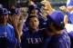 ARLINGTON, TX - SEPTEMBER 25: Ian Kinsler #5 of the Texas Rangers is congratulated by his teammates for hitting a solo home run in the sixth inning against the Houston Astros at Rangers Ballpark in Arlington on September 25, 2013 in Arlington, Texas. (Pho