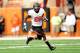 AUSTIN, TX - NOVEMBER 16: Desmond Roland #26 of the Oklahoma State Cowboys runs for yards against the Texas Longhorns during a game at Darrell K Royal-Texas Memorial Stadium on November 16, 2013 in Austin, Texas. Oklahoma State won the game 38-13. (Pho