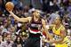 Nov 1, 2013; Denver, CO, USA; Portland Trail Blazers small forward Nicolas Batum (88) keeps the ball from Denver Nuggets point guard Randy Foye (4) in the third quarter at the Pepsi Center. The Trail Blazers won 113-98. Mandatory Credit: Isaiah J. Downing