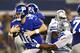 ARLINGTON, TX - SEPTEMBER 8: Eli Manning #10 of the New York Giants runs the ball to avoid the pass rush during a game against the Dallas Cowboys at AT&T Stadium on September 8, 2013 in Arlington, Texas. (Photo by Wesley Hitt/Getty Images)
