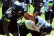 Jul 3, 2013; Beaverton, OR, USA; Defensive lineman Da'Shawn Hand (55) battles offensive lineman Toa Lobendahn (54) during the Lineman Challenge session of the 'The Opening' at Nike World Headquarters. Mandatory Credit: Steve Dykes-USA TODAY Sports