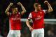 LONDON, ENGLAND - NOVEMBER 02: Laurent Koscielny of Arsenal and Per Mertesacker of Arsenal celebrate victory at the final whistle during the Barclays Premier League match between Arsenal and Liverpool at Emirates Stadium on November 2, 2013 in London, En