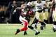 NEW ORLEANS, LA - SEPTEMBER 08: Harry Douglas #83 of the Atlanta Falcons is tackled by Corey White #28 of the New Orleans Saints during a game at the Mercedes-Benz Superdome on September 8, 2013 in New Orleans, Louisiana. The Saints defeated the Falcons 2