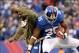 Nov 10, 2013; East Rutherford, NJ, USA; New York Giants running back Andre Brown (35) celebrates a touchdown with New York Giants running back Brandon Jacobs (34) (not playing) during the third quarter agains the the Oakland Raiders at MetLife Stadium. Ma