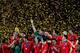 JOHANNESBURG, SOUTH AFRICA - JULY 11: The Spain team celebrate winning the World Cup as captain Iker Casillas (C) waves to fans during the 2010 FIFA World Cup South Africa Final match between Netherlands and Spain at Soccer City Stadium on July 11, 2010