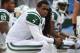 ORCHARD PARK, NY - NOVEMBER 17: Geno Smith #7 of the New York Jets looks on from the bench after throwing an interception during NFL game action against the Buffalo Bills at Ralph Wilson Stadium on November 17, 2013 in Orchard Park, New York. (Photo by To