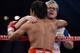 LAS VEGAS, NV - JUNE 09: (R-L) Trainer Freddie Roach gives Manny Pacquiao a hug between rounds during his bout against Timothy Bradley at MGM Grand Garden Arena on June 9, 2012 in Las Vegas, Nevada. (Photo by Kevork Djansezian/Getty Images)