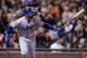 SAN FRANCISCO, CA - SEPTEMBER 24: Matt Kemp #27 of the Los Angeles Dodgers swings and watches the flight of his ball as he hits a solo home run during the sixth inning against the San Francisco Giants at AT&T Park on September 24, 2013 in San Francisco,