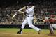 SAN DIEGO, CA - SEPTEMBER 25: Chase Headley #7 of the San Diego Padres hits an RBI double during the first inning of a baseball game against the Arizona Diamondbacks at Petco Park on September 25, 2013 in San Diego, California. (Photo by Denis Poroy/Get
