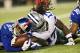ARLINGTON, TX - SEPTEMBER 8: Jayron Hosley #28 of the New York Giants and Dwayne Harris #17 of the Dallas Cowboys go after a fumble at AT&T Stadium on September 8, 2013 in Arlington, Texas. The Cowboys defeated the Giants 31-36. (Photo by Wesley Hitt/G