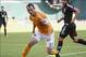 Oct 27, 2013; Washington, DC, USA; Houston Dynamo midfielder Brad Davis (11) brings the ball forward against D.C. United midfielder Nick DeLeon (18) during the second half at Robert F. Kennedy Memorial. Mandatory Credit: Paul Frederiksen-USA TODAY Sports