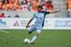 Nov 9, 2013; Houston, TX, USA; Sporting KC midfielder/forward Graham Zusi (8) kicks the ball against the Houston Dynamo during the MLS Eastern Conference Championship soccer game at BBVA Compass Stadium. Mandatory Credit: Troy Taormina-USA TODAY Sports