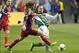 Nov 10, 2013; Sandy, UT, USA; Real Salt Lake midfielder Kyle Beckerman (5) and Portland Timbers defender Michael Harrington (5) battle for the ball during the first half of a Western Conference Championship match at Rio Tinto Stadium. Mandatory Credit: Ru