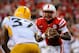 LINCOLN, NE - SEPTEMBER 7: Quarterback Tommy Armstrong Jr. #4 of the Nebraska Cornhuskers eyes linebacker Alan Howze #37 of the Southern Miss Golden Eagles during their game at Memorial Stadium on September 7, 2013 in Lincoln, Nebraska. Nebraska defeated