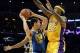 Nov 22, 2013; Los Angeles, CA, USA; Golden State Warriors shooting guard Klay Thompson (11) drives against Los Angeles Lakers center Jordan Hill (27) during the first half at Staples Center. Mandatory Credit: Richard Mackson-USA TODAY Sports