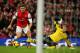 LONDON, ENGLAND - NOVEMBER 23: Olivier Giroud of Arsenal rounds goalkeeper Artur Boruc of Southampton before scoring the opening goal during the Barclays Premier League match between Arsenal and Southampton at Emirates Stadium on November 23, 2013 in Lond