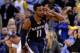 OAKLAND, CA - NOVEMBER 20: Mike Conley #11 of the Memphis Grizzlies reacts after he made a three-point basket over Andre Iguodala #9 of the Golden State Warriors in overtime at ORACLE Arena on November 20, 2013 in Oakland, California. NOTE TO USER: Use