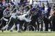 EVANSTON, IL - NOVEMBER 23: Tony Jones #6 of the Northwestern Wildcats is tackled by RJ Williamson #26 of the Michigan State Spartans during the first half on November 23, 2013 at Ryan Field in Evanston, Illinois. (Photo by David Banks/Getty Images)