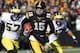 IOWA CITY, IA - NOVEMBER 23: Quarterback Jake Rudock #15 of the Iowa Hawkeyes scrambles on a keeper during the first quarter in front of defensive end Frank Clark #57 of the Michigan Wolverines on November 23, 2013 at Kinnick Stadium in Iowa City, Iowa. (