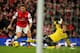 LONDON, ENGLAND - NOVEMBER 23: Olivier Giroud of Arsenal rounds goalkeeper Artur Boruc of Southampton before scoring the opening goal during the Barclays Premier League match between Arsenal and Southampton at Emirates Stadium on November 23, 2013 in Lond