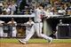 June 19, 2012; Bronx, NY, USA; Atlanta Braves catcher Brian McCann (16) hits a ground rule double to center against the New York Yankees during the sixth inning at Yankee Stadium. Braves won 4-3. Mandatory Credit: Debby Wong-USA TODAY Sports