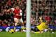 LONDON, ENGLAND - NOVEMBER 23: Olivier Giroud of Arsenal rounds goalkeeper Artur Boruc of Southampton before scoring the opening goal during the Barclays Premier League match between Arsenal and Southampton at Emirates Stadium on November 23, 2013 in Lon