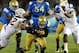 Nov 23, 2013; Pasadena, CA, USA; UCLA Bruins quarterback Brett Hundley (17) runs through Arizona State Sun Devils linebacker Carl Bradford (52) and Arizona State Sun Devils linebacker Anthony Jones (31)for 2 yards on 4th down in the first half of the g