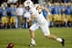 PASADENA, CA - NOVEMBER 23: Punter Alex Garoutte #25 of the Arizona State Sun Devils chases the ball after dropping the snap during the third quarter against the UCLA Bruins at Rose Bowl on November 23, 2013 in Pasadena, California. (Photo by Harry How/
