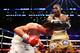 NEW YORK, NY - JUNE 22: Adrien Broner (R) lands a punch on Paulie Malignaggi during their WBA Welterweight Title bout at Barclays Center on June 22, 2013 in the Brooklyn borough of New York City. (Photo by Al Bello/Getty Images)