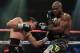 LAS VEGAS, NV - OCTOBER 12: Juan Manuel Marquez (L) punches WBO welterweight champion Timothy Bradley Jr. (R) in the body during their bout at the Thomas & Mack Center on October 12, 2013 in Las Vegas, Nevada. (Photo by Jeff Bottari/Getty Images)