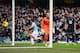 MANCHESTER, ENGLAND - NOVEMBER 24: Sergio Aguero of Manchester City scores his team's third goal past goalkeeper Hugo Lloris of Tottenham Hotspur during the Barclays Premier League match between Manchester City and Tottenham Hotspur at Etihad Stadium on